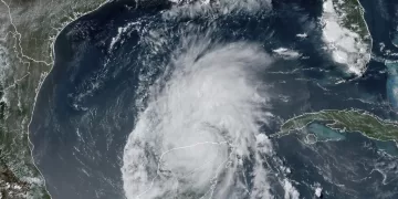 This GOES-16 GeoColor satellite image taken at 4:16 p.m. EDT on Friday, July 5, 2024, and provided by NOAA, shows Hurricane Beryl over Mexico’s Yucatan Peninsula. Texas officials urged coastal residents to prepare as the storm moves toward the Gulf of Mexico.  (NOAA via AP)
