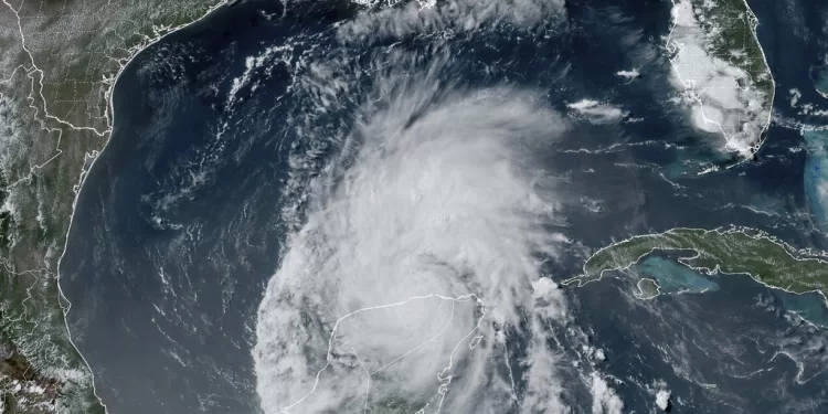 This GOES-16 GeoColor satellite image taken at 4:16 p.m. EDT on Friday, July 5, 2024, and provided by NOAA, shows Hurricane Beryl over Mexico’s Yucatan Peninsula. Texas officials urged coastal residents to prepare as the storm moves toward the Gulf of Mexico.  (NOAA via AP)